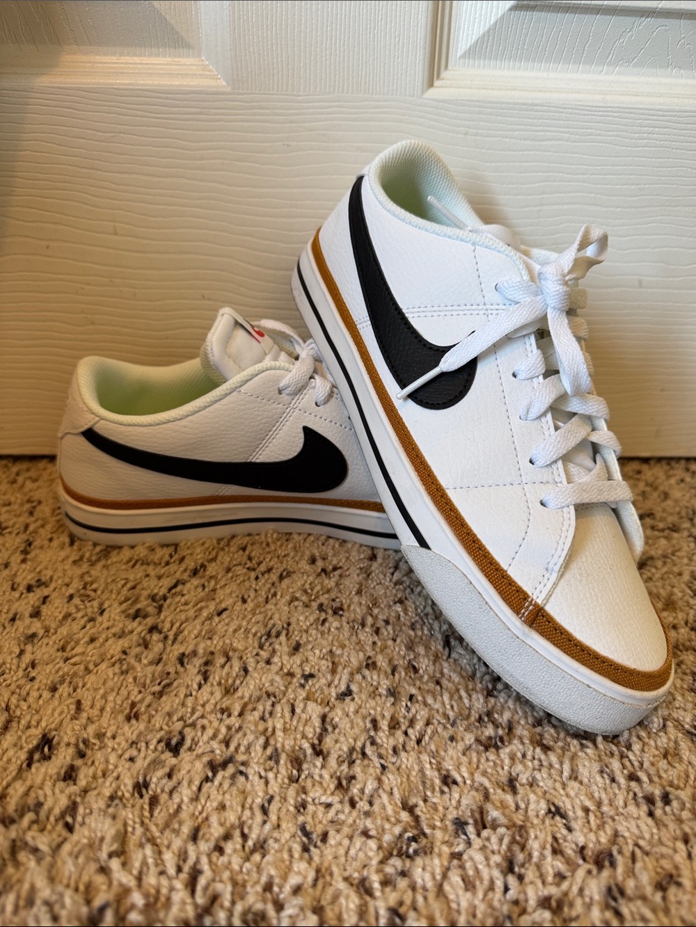 Nike Women’s White Sneakers with Black Swoosh and Brown Accent